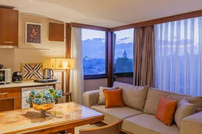 a living room with a couch and a table at Lord Morgan & Exclusive Design Residence Cihangir in Istanbul