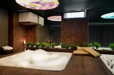a living room with a large white couch in the floor at Wyndham Cerkezkoy in Cerkezkoy
