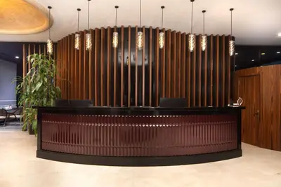 a lobby with a bar with a large organ at Ramada Plaza by Wyndham Istanbul Atakoy in Istanbul