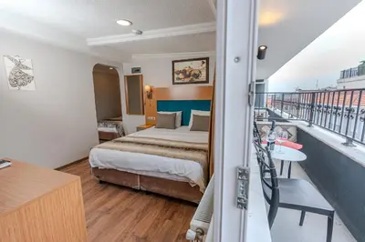 a hotel room with a bed and a balcony at Seatanbul Hotel in Istanbul