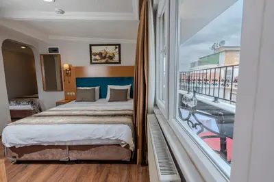 a hotel room with a bed and a large window at Seatanbul Hotel in Istanbul