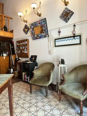 a living room with two chairs and a table at Tom Square Boutique Hotel in Istanbul