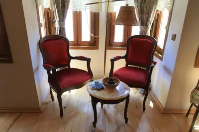 a living room with two chairs and a table at Tom Square Boutique Hotel in Istanbul
