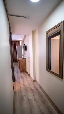an empty room with a mirror on the wall at La Fortuna Taksim Hotel in Istanbul