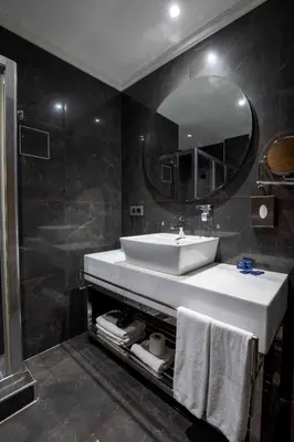 a bathroom with a sink and a mirror at Park Inn by Radisson Istanbul Asia Kavacik in Istanbul