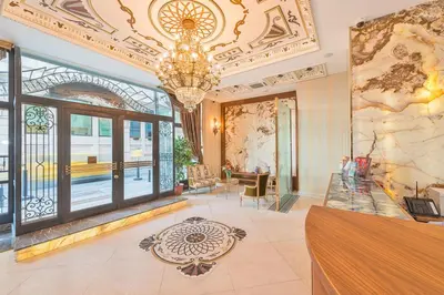 a lobby with a chandelier and a large window at Hotel The Pera Hill in Istanbul