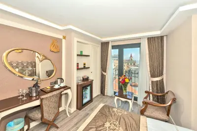 a hotel room with a desk and a mirror at Hotel The Pera Hill in Istanbul