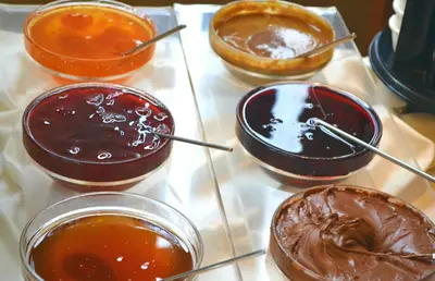 a tray with four different types of chocolate desserts at Hotel The Pera Hill in Istanbul