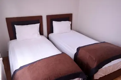 two beds sitting next to each other in a room at Sheriff Residence in Istanbul