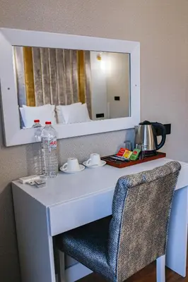 a white desk with a chair and a mirror at Vital Thermal Hotel & SPA in Termal