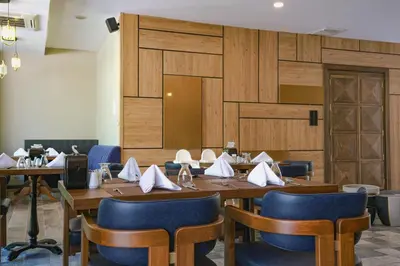 a conference room with wooden walls and tables and chairs at Vital Thermal Hotel & SPA in Termal