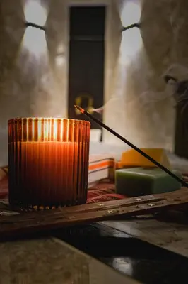 an orange candle sitting on top of a table at Vital Thermal Hotel & SPA in Termal