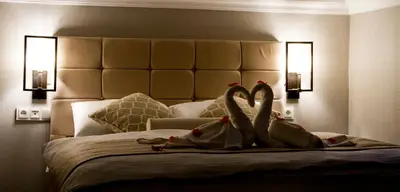 a group of people with their feet up on a bed at Hit Suites Avcilar Hotel in Avcılar
