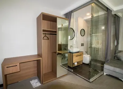 a bathroom with a glass shower and a sink at Hit Suites Avcilar Hotel in Avcılar