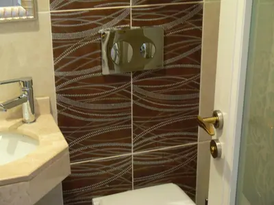 a bathroom with a shower stall with a toilet and a sink at Hotel Coliseum in Istanbul