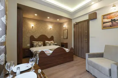 a hotel room with a bed and a couch at Capricorn by Otantik Suites in Istanbul