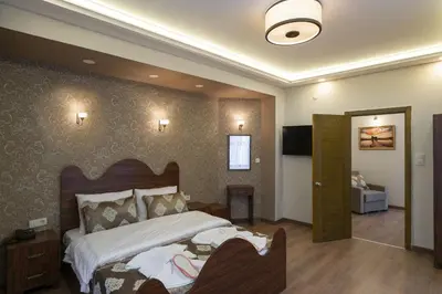 a bedroom with a large bed and a television in it at Capricorn by Otantik Suites in Istanbul