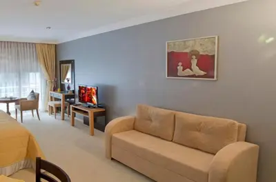 a living room with a couch and a room with a table at The Bosphorus House in Istanbul