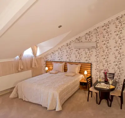 a bedroom with a bed and a desk with a table sidx sidx sidx at The Bosphorus House in Istanbul