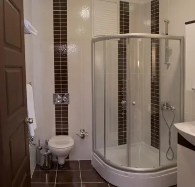 a bathroom with a toilet and a glass shower at The Bosphorus House in Istanbul