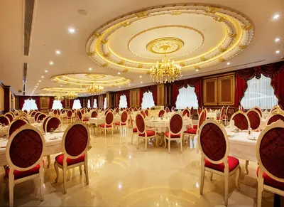 a banquet hall with a long table and chairs at Ottoman's Life Hotel Deluxe in Istanbul