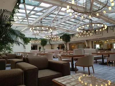 a restaurant with tables and chairs and chandeliers at Ottoman's Life Hotel Deluxe in Istanbul