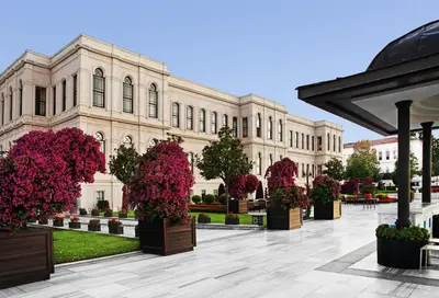 a large building with potted plants in front of it at Four Seasons Hotel Istanbul at the Bosphorus in Istanbul
