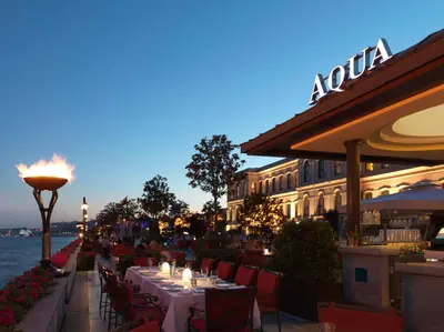 a restaurant with tables and chairs in front of a building at Four Seasons Hotel Istanbul at the Bosphorus in Istanbul