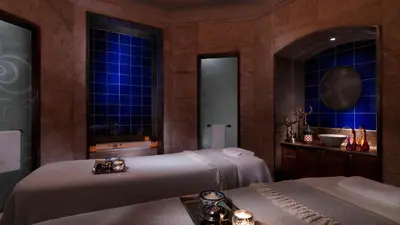 a bedroom with two beds and a bath tub at Four Seasons Hotel Istanbul at the Bosphorus in Istanbul