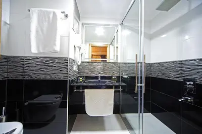 a bathroom with a sink and a toilet and a shower at Ottopera Hotel in Istanbul