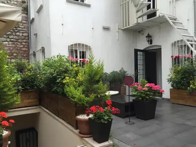 a courtyard with potted plants on the side of a building at Premist Hotels Sultanahmet in Istanbul