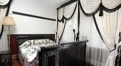 a bedroom with a canopy bed and curtains at Premist Hotels Sultanahmet in Istanbul