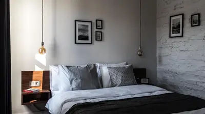 a bedroom with a bed and some pictures on the wall at HAUS Galata in Istanbul