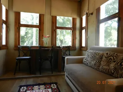 a living room with windows and a couch and a table at Royal Suites Sultanahmet in Istanbul