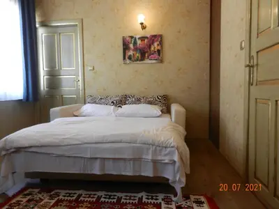 a bedroom with a white bed in a room at Royal Suites Sultanahmet in Istanbul