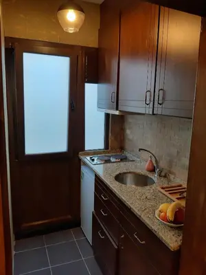 a kitchen with a sink and a counter top at Royal Suites Sultanahmet in Istanbul