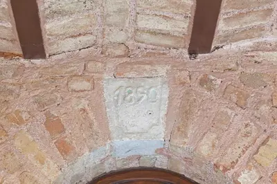 a stone plaque on the side of a brick building at Celine Hotel - Ottoman Mansion in Istanbul