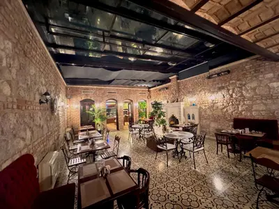 a restaurant with tables and chairs in a room at Celine Hotel - Ottoman Mansion in Istanbul