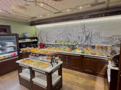a buffet line with many different types of food at Celine Hotel - Ottoman Mansion in Istanbul