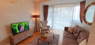 a living room with a couch and a tv at Taksim leylak suite in Istanbul