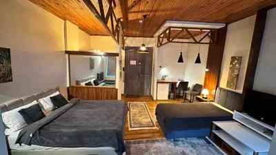 a bedroom with two beds and a living room at New Pera in Istanbul