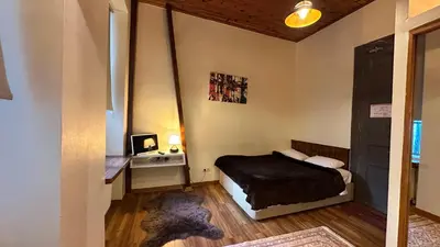 a small bedroom with a bed and a desk at New Pera in Istanbul