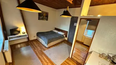 a small bedroom with a bed and a television at New Pera in Istanbul