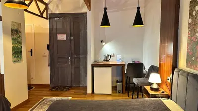 a room with a door and a table with a chair at New Pera in Istanbul