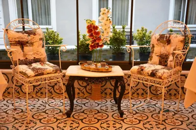 two chairs and a coffee table in a room at Elyka Hotel in Istanbul