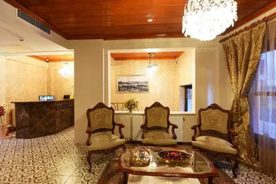 a living room with two chairs and a table at Elyka Hotel in Istanbul