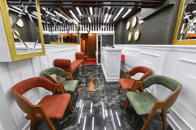 a waiting room with chairs and a mirror at Sea Moon Hotel in Istanbul