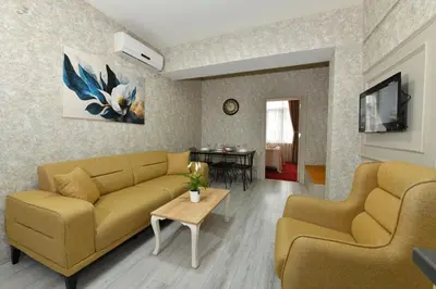 a living room with a couch and a table at Sea Moon Hotel in Istanbul