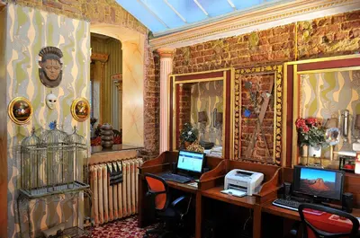 a room with a desk with a laptop computer on it at Grand Hotel de Londres in Istanbul