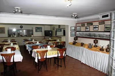a dining room with tables and chairs in a restaurant at Kadikoy Otel in Istanbul
